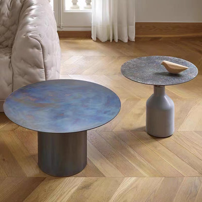 Mesa de centro redonda con base de mármol y tapa de acero inoxidable